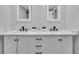 Double vanity bathroom with marble countertops and modern fixtures at 2371 Shipwatch Rd, Kiawah Island, SC 29455