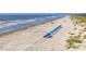 Beach with blue umbrellas at 2371 Shipwatch Rd, Kiawah Island, SC 29455