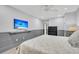 Bedroom with a queen bed, TV, and gray wainscoting at 2371 Shipwatch Rd, Kiawah Island, SC 29455