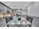 Gray kitchen with stainless steel appliances and a glass-top dining table at 2371 Shipwatch Rd, Kiawah Island, SC 29455