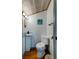 Small half bathroom with wood flooring and beach decor at 251 Driftwood Ln # 251, Edisto Island, SC 29438