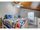 Cozy twin bedroom with nautical decor and wood ceiling at 251 Driftwood Ln # 251, Edisto Island, SC 29438