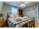 Bright bedroom featuring a multicolored quilt and ceiling fan at 251 Driftwood Ln # 251, Edisto Island, SC 29438