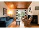 Cozy living room with fireplace, comfy seating, and wood ceilings at 251 Driftwood Ln # 251, Edisto Island, SC 29438