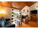 Cozy living room featuring a fireplace, comfy seating, and wood ceilings at 251 Driftwood Ln # 251, Edisto Island, SC 29438