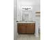 Bathroom features wood vanity, updated lighting, and a large mirror at 267 Alexandra # 6, Mount Pleasant, SC 29464
