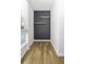 Small office space with dark gray plank accent wall and floating shelves at 267 Alexandra # 6, Mount Pleasant, SC 29464