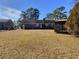 Large backyard with gazebo and mature trees at 303 Swamp Fox Ln, Goose Creek, SC 29445