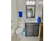 Bathroom features a vanity with a white marble countertop and a framed mirror at 303 Swamp Fox Ln, Goose Creek, SC 29445