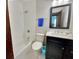 Bright bathroom features a white tub and shower combination and a modern vanity at 303 Swamp Fox Ln, Goose Creek, SC 29445