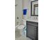 Updated bathroom with dark vanity, marble countertop, and tiled floor at 303 Swamp Fox Ln, Goose Creek, SC 29445