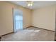 Bright bedroom featuring a large window and ceiling fan at 303 Swamp Fox Ln, Goose Creek, SC 29445