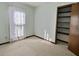 Well-lit bedroom with built-in shelving and window at 303 Swamp Fox Ln, Goose Creek, SC 29445