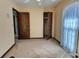 Spacious carpeted bedroom with closet, ceiling fan and light from a sunny window at 303 Swamp Fox Ln, Goose Creek, SC 29445