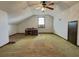 Spacious bonus room with window, ceiling fan and carpet flooring at 303 Swamp Fox Ln, Goose Creek, SC 29445