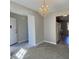 Bright dining room with chandelier and access to kitchen at 303 Swamp Fox Ln, Goose Creek, SC 29445