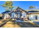 Brick ranch home with attached two-car garage at 303 Swamp Fox Ln, Goose Creek, SC 29445