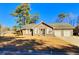 Brick ranch home with attached two-car garage at 303 Swamp Fox Ln, Goose Creek, SC 29445