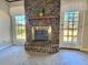 Brick fireplace with a modern mantel and hearth at 303 Swamp Fox Ln, Goose Creek, SC 29445