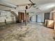 Spacious garage with shelving, workbench, and two garage doors at 303 Swamp Fox Ln, Goose Creek, SC 29445