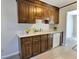 Kitchen with wood cabinets, updated countertops and flooring at 303 Swamp Fox Ln, Goose Creek, SC 29445