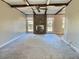 Bright living room with a brick fireplace and wood beams, offering a cozy atmosphere at 303 Swamp Fox Ln, Goose Creek, SC 29445