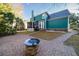 Home's backyard with fire pit and patio at 3100 Sonja Way, Mount Pleasant, SC 29466