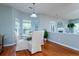 Bright dining room features hardwood floors and a charming round table with seating for four at 3100 Sonja Way, Mount Pleasant, SC 29466