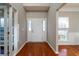 Two story foyer with hardwood floors and white doors at 3100 Sonja Way, Mount Pleasant, SC 29466