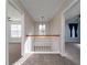 Upstairs hallway with a view of the lower level through a white railing at 3100 Sonja Way, Mount Pleasant, SC 29466