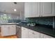 Modern kitchen with white cabinets and blue tile backsplash at 3100 Sonja Way, Mount Pleasant, SC 29466