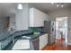 Eat-in kitchen with white cabinets, dark countertops, and stainless steel appliances at 3100 Sonja Way, Mount Pleasant, SC 29466