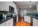 Updated kitchen featuring white cabinets, mosaic backsplash and stainless steel appliances at 3100 Sonja Way, Mount Pleasant, SC 29466