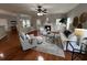 Light-filled living room with hardwood floors, fireplace, and comfy seating at 3100 Sonja Way, Mount Pleasant, SC 29466