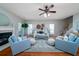Spacious living room boasts hardwood floors, fireplace, and comfortable seating at 3100 Sonja Way, Mount Pleasant, SC 29466