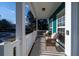 Inviting front porch with wicker chairs and white railing at 3100 Sonja Way, Mount Pleasant, SC 29466