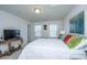 Bright bedroom featuring a comfortable bed and a large TV at 3157 Timberline Dr, Johns Island, SC 29455