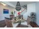Glass-top dining table with four chairs, wine rack, and chandelier at 3157 Timberline Dr, Johns Island, SC 29455