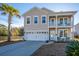 Two-story house with a two-car garage and water view at 3157 Timberline Dr, Johns Island, SC 29455