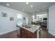 Kitchen island with granite countertops and double sink, open to Gathering room at 3157 Timberline Dr, Johns Island, SC 29455