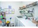 Bright laundry room with washer, dryer, and ample storage shelving at 3157 Timberline Dr, Johns Island, SC 29455