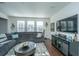 Spacious living room with sectional sofa and large TV at 3157 Timberline Dr, Johns Island, SC 29455