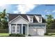 Two-story craftsman style home with blue siding, white accents, and a two-car garage at 374 Trailmore Ln, Summerville, SC 29486