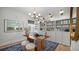 Bright home office features built-in shelving, a large desk, and hardwood floors at 374 Trailmore Ln, Summerville, SC 29486