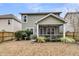 House with a fenced backyard, covered porch, and landscaping at 3765 Sawmill Ct, Mount Pleasant, SC 29429