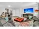 Finished basement with sectional sofa, large TV, and plenty of seating at 3765 Sawmill Ct, Mount Pleasant, SC 29429
