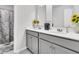 Bathroom boasts double vanity, gray cabinets, and a shower at 3765 Sawmill Ct, Mount Pleasant, SC 29429