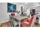Charming dining area with a rustic table and coral chairs at 3765 Sawmill Ct, Mount Pleasant, SC 29429