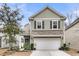 Beautiful two-story home with a gray exterior and a white garage door at 3765 Sawmill Ct, Mount Pleasant, SC 29429