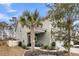 Green house exterior with a palm tree and a walkway to the entrance at 3765 Sawmill Ct, Mount Pleasant, SC 29429